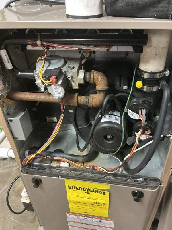 Completed routine annual maintenance on a 4-year-old air conditioning system and 15-year-old forced air furnace. Performed comprehensive inspection of all internal components including gas valve assembly, blower motor, heat exchanger, copper refrigerant lines, and electrical connections. Verified thermostat operation displaying proper temperature readings and system cycling. Inspected condensate drainage system, PVC vent piping, and all safety controls. Both systems operating within normal parameters with no deficiencies noted at time of service.