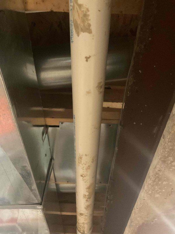 Completed estimate for mini split installation at residential property. Inspected existing HVAC system including ductwork and furnace filter locations to determine optimal placement for new mini split system. Documented current conditions of mechanical space showing PVC drainage lines and metal ductwork infrastructure to assess installation requirements and potential modifications needed for mini split equipment.