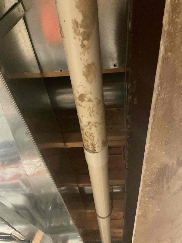 Completed estimate for mini split installation at residential property. Inspected existing HVAC system including ductwork and furnace filter locations to determine optimal placement for new mini split system. Documented current conditions of mechanical space showing PVC drainage lines and metal ductwork infrastructure to assess installation requirements and potential modifications needed for mini split equipment.