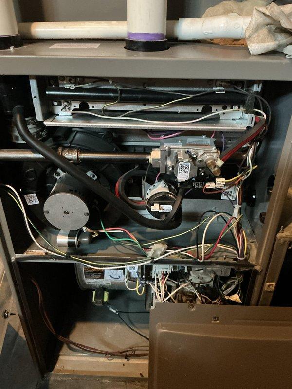 Completed comprehensive 5-year ComfortGuard maintenance visit on residential HVAC system. Performed thorough inspection of furnace unit, including examination of gas valves, burner assembly, ignition components, and all electrical connections. Verified proper operation of ecobee smart thermostat displaying current temperature settings and humidity levels at 48%. All mechanical components, wiring harnesses, and safety controls found to be in good operational condition with no signs of wear or deterioration requiring immediate attention.