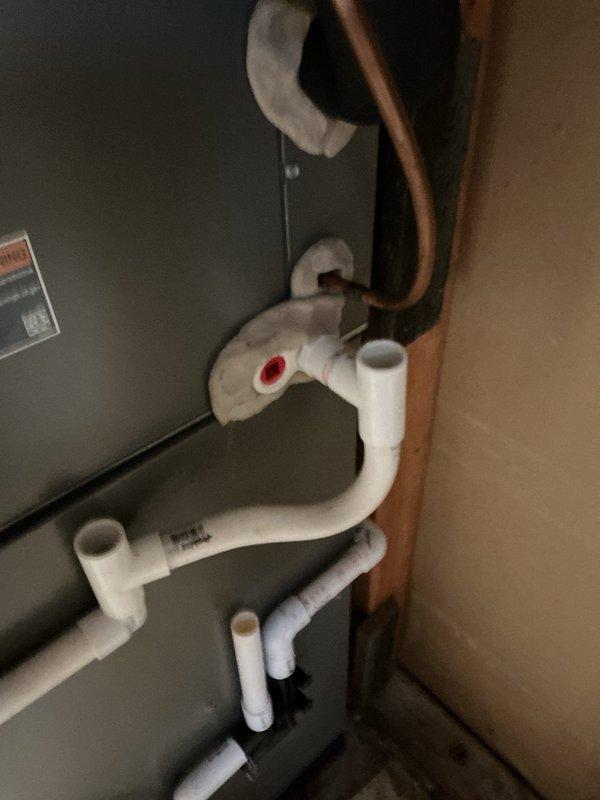 Completed comprehensive 5-year recurring ComfortGuard maintenance service on residential HVAC system. Performed thorough inspection of furnace/air handler unit, humidifier control system with humidity settings verified operational, and associated refrigerant line assembly. Examined all copper tubing, PVC condensate drain routing with trap configuration, insulated refrigerant lines, and connection points for proper installation and function. Verified humidifier control panel calibration, inspected brass fittings and valve operations, and confirmed all mechanical components operating within manufacturer specifications. System found in good working condition with no immediate service needs identified.