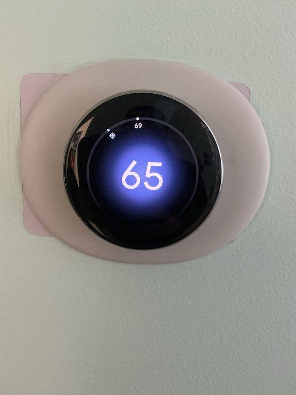 Completed routine annual maintenance on a one-year-old central air conditioning system located in basement. Performed comprehensive tune-up including inspection of all major components, verified refrigerant levels, checked electrical connections, and tested system operation. Installed new pleated air filter with cardboard frame and diagonal support struts. Confirmed smart thermostat functioning properly, displaying set temperature of 65°F with current reading of 69°F in cooling mode. All system parameters within normal operating range with no deficiencies noted. Unit operating efficiently with no reported issues or symptoms from occupant.