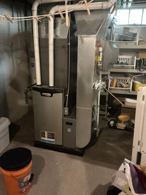 Completed routine preventative maintenance on a 6-year-old central air conditioning system. Performed comprehensive tune-up including inspection of outdoor condensing unit, indoor evaporator coil, and associated components. Verified Lennox smart thermostat operation and confirmed system cooling to setpoint of 64°F with proper temperature differential. Inspected furnace cabinet and ductwork in basement mechanical room, checking for proper airflow and secure connections. Cleaned condenser coils, checked refrigerant pressures, tested electrical connections, and verified proper system operation. All components functioning within manufacturer specifications with no issues identified or repairs required.