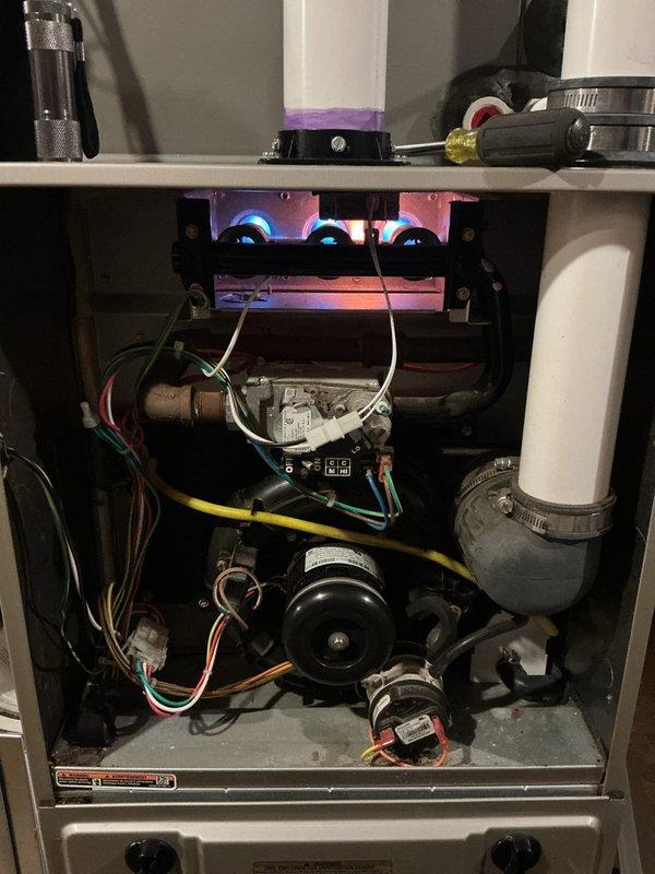 Completed comprehensive annual maintenance on both the 5-year-old air conditioning system and 11-year-old forced air furnace. Performed full inspection of furnace components including burner assembly, gas valve connections, blower motor, inducer motor, and all electrical connections. Verified proper burner ignition and flame characteristics, inspected heat exchanger, checked all safety controls, and tested thermostat operation. Examined condensate drainage system with PVC piping and confirmed proper function. Conducted complete AC tune-up including condenser unit inspection, refrigerant level check, electrical component testing, and airflow verification. Both systems operating within manufacturer specifications with no issues identified. All components functioning properly and safely.
