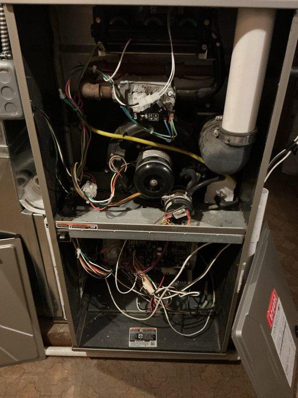 Completed comprehensive annual maintenance on both the 5-year-old air conditioning system and 11-year-old forced air furnace. Performed full inspection of furnace components including burner assembly, gas valve connections, blower motor, inducer motor, and all electrical connections. Verified proper burner ignition and flame characteristics, inspected heat exchanger, checked all safety controls, and tested thermostat operation. Examined condensate drainage system with PVC piping and confirmed proper function. Conducted complete AC tune-up including condenser unit inspection, refrigerant level check, electrical component testing, and airflow verification. Both systems operating within manufacturer specifications with no issues identified. All components functioning properly and safely.