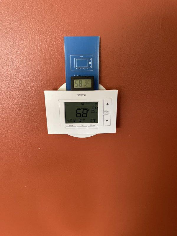 Completed installation of 2-ton air conditioning unit with evaporator coil at rear location. Reconnected all electrical and refrigerant lines, installed new Sensi digital programmable thermostat with proper wiring and configuration. Verified system operation, refrigerant charge, and proper condensate drainage through existing PVC drain line. All work performed in accordance with mechanical permit requirements.