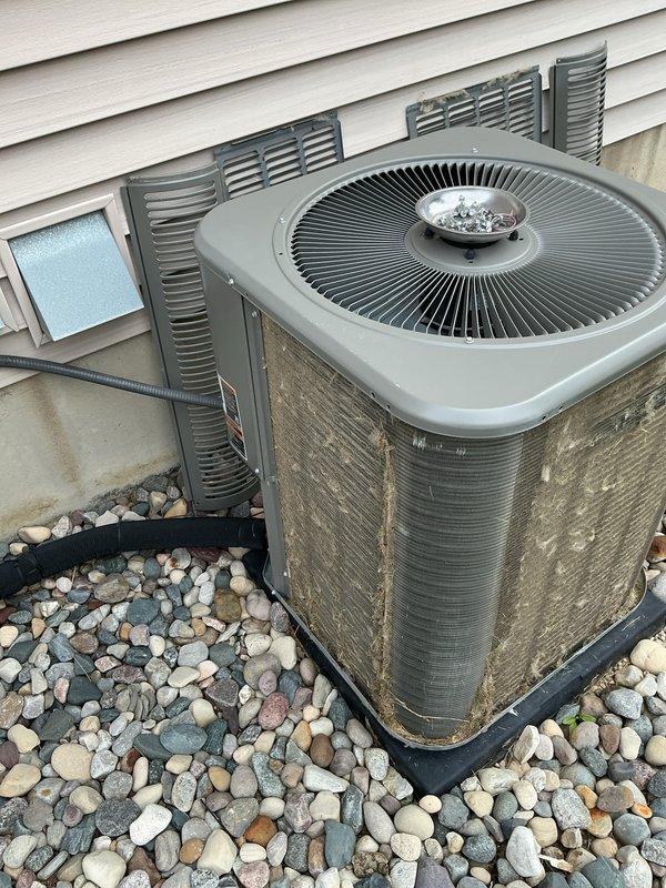 Completed routine air conditioning tune-up on 5-year-old outdoor condenser unit and indoor air handler system. Performed comprehensive inspection of both indoor and outdoor components, including blower motor assembly, electrical connections, and refrigerant lines. Verified all wiring harnesses, checked motor operation, and confirmed proper airflow through the system. Inspected outdoor condenser unit for debris accumulation and weathering, noting normal wear consistent with age and exposure. All components found to be operating within normal parameters with no deficiencies requiring immediate attention.