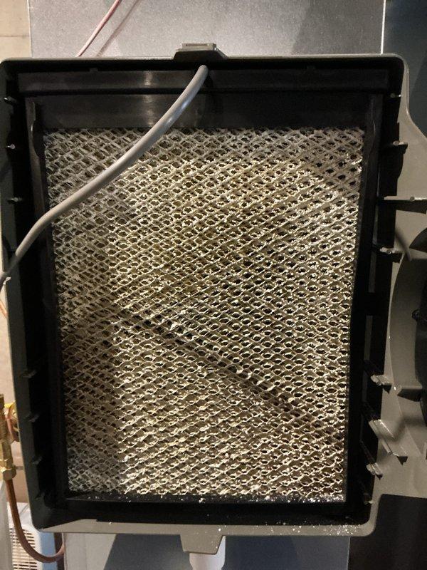 Completed comprehensive preventive maintenance on a four-year-old split system air conditioning and furnace unit as part of routine ComfortGuard Maintenance Package. Performed full system inspection of both heating and cooling components, including air filter examination showing clean diamond-pattern expanded metal mesh filter in proper condition. Conducted electrical diagnostics using clamp meter to verify amperage draws and system performance, with readings indicating normal operating parameters at 37.5 amps. Inspected outdoor condensing unit, indoor air handler, and furnace components with no deficiencies noted. All safety controls, electrical connections, and mechanical components operating within manufacturer specifications with no repairs required at this time.