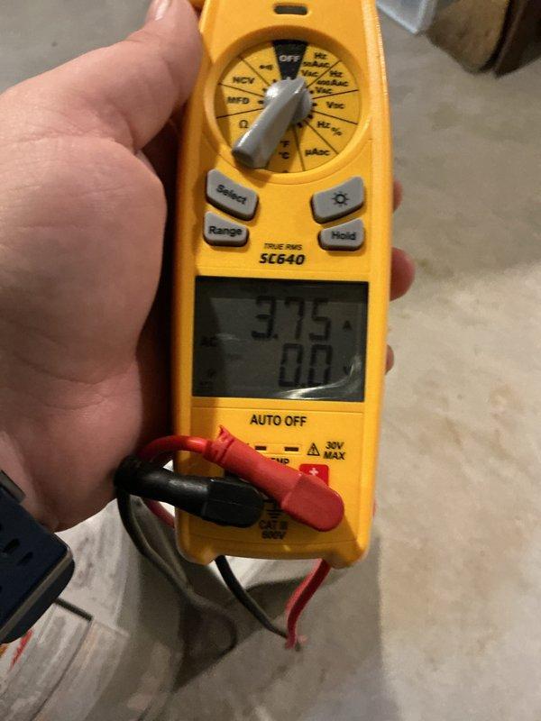 Completed comprehensive preventive maintenance on a four-year-old split system air conditioning and furnace unit as part of routine ComfortGuard Maintenance Package. Performed full system inspection of both heating and cooling components, including air filter examination showing clean diamond-pattern expanded metal mesh filter in proper condition. Conducted electrical diagnostics using clamp meter to verify amperage draws and system performance, with readings indicating normal operating parameters at 37.5 amps. Inspected outdoor condensing unit, indoor air handler, and furnace components with no deficiencies noted. All safety controls, electrical connections, and mechanical components operating within manufacturer specifications with no repairs required at this time.