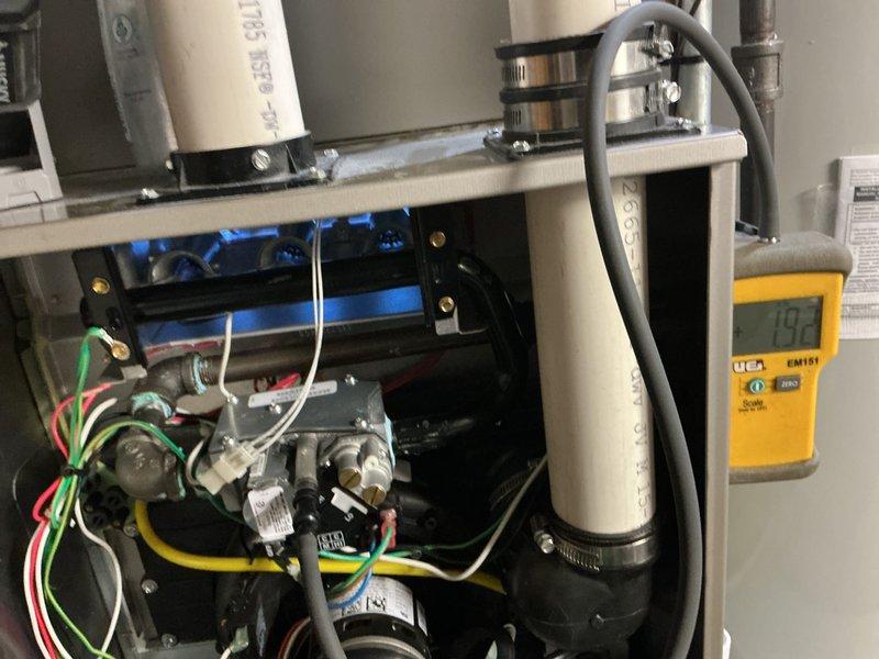Completed routine fall furnace maintenance and tune-up on 10-year-old unit prior to heating season. Performed comprehensive system inspection including blower motor assembly, gas valve controls, ignition components, electrical connections, and wiring harnesses. Verified all mechanical connections secure, tested gas control valves and burner assembly, confirmed proper wire routing throughout compartment, and measured system temperatures to ensure unit operating within normal parameters. All components found in good working condition with no issues identified.