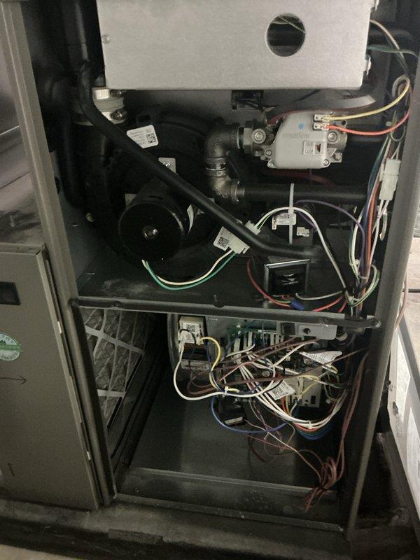 Completed comprehensive annual maintenance on 3-year-old residential HVAC system including both furnace and air conditioner units. Performed full system inspection with access panel removal to examine internal components, electrical connections, gas valve assembly, heat exchanger, and blower motor. Verified all wire harnesses, control modules, and capacitor connections were secure and properly labeled. Inspected condensate drainage system, burner assembly, and ductwork connections. Tested system operation and confirmed both heating and cooling functions performing within normal parameters with no deficiencies noted.