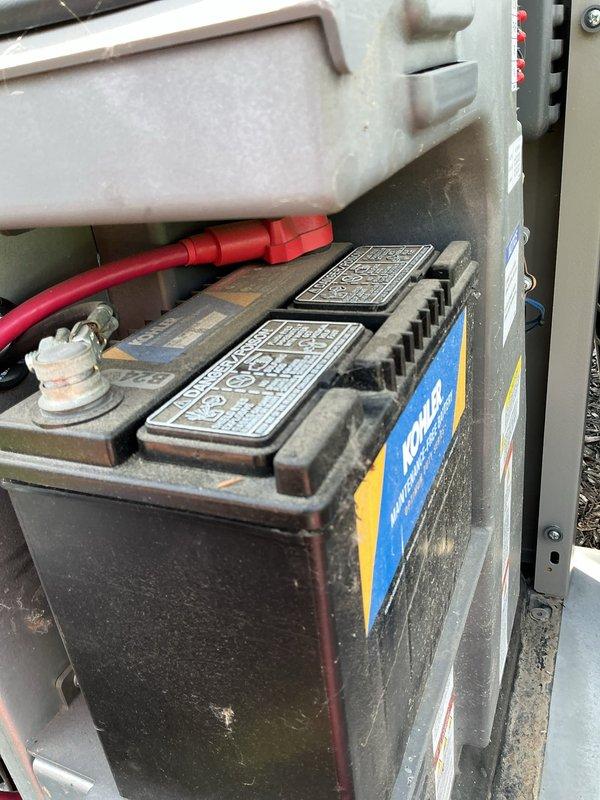 Completed scheduled preventive maintenance on a 20kW Kohler standby generator system. Performed comprehensive inspection of all major components including engine assembly, fuel system, cooling system, and electrical connections. Changed engine oil and replaced Kohler-branded oil filter. Inspected battery terminals and cable connections for proper contact and corrosion, verified battery condition and secure mounting in tray. Checked all fluid levels including coolant reservoir. Examined air intake system and fuel delivery components for proper operation. Verified all hoses, belts, and electrical wiring for wear or damage. Unit tested and operating within normal parameters upon completion.