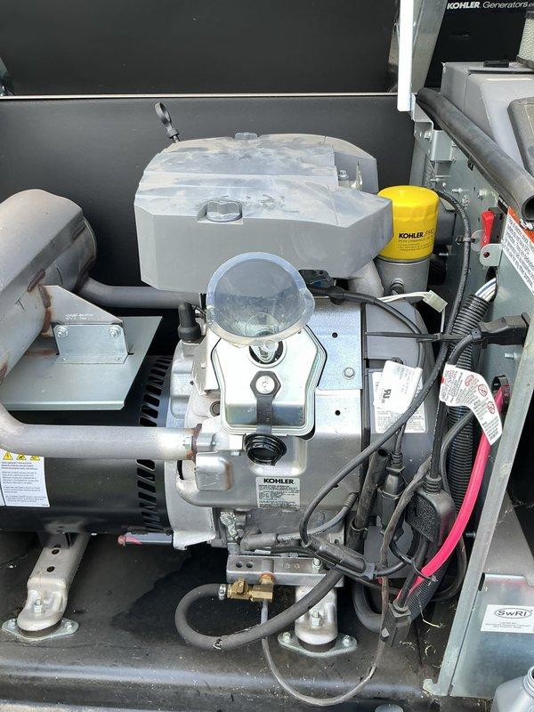 Completed scheduled preventive maintenance on a 20kW Kohler standby generator system. Performed comprehensive inspection of all major components including engine assembly, fuel system, cooling system, and electrical connections. Changed engine oil and replaced Kohler-branded oil filter. Inspected battery terminals and cable connections for proper contact and corrosion, verified battery condition and secure mounting in tray. Checked all fluid levels including coolant reservoir. Examined air intake system and fuel delivery components for proper operation. Verified all hoses, belts, and electrical wiring for wear or damage. Unit tested and operating within normal parameters upon completion.