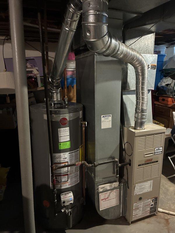 Responded to townhome for water leaking from furnace. Upon inspection, found aging HVAC system with 30+ year old furnace and water heater in basement mechanical room. Assessed equipment condition and discussed replacement options with homeowner. Provided estimate for new air conditioning system installation to address aging equipment concerns and water leakage issue originating from furnace area.