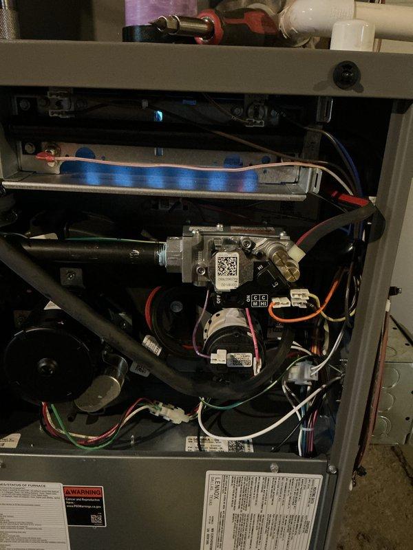 Completed comprehensive AC tune-up and cooling system maintenance on residential split system air conditioning unit. Performed standard preventive maintenance protocol including inspection of furnace and heating components during service visit. Verified proper ignition system operation with blue flame combustion visible, inspected gas valve assembly, electrical connections, and blower motor components. All wiring, control boards, and safety mechanisms found secure and functioning within normal parameters. System operational with no issues identified.