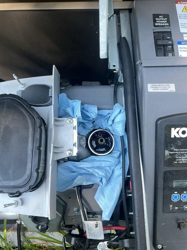 Completed routine electrical maintenance on a Kohler 20kW standby generator system. Performed comprehensive inspection of engine compartment, verified proper operation of AC output power breaker panel, and confirmed all control systems and electrical connections were secure and functioning correctly.