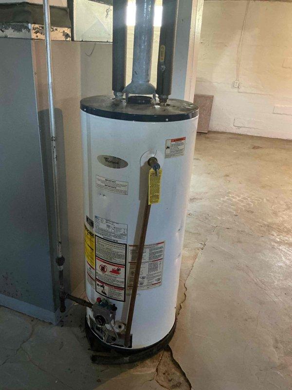 Responded to service call for State brand natural gas water heater with extinguished pilot light. Successfully re-ignited pilot light and verified proper flame operation and burner functionality. Unit restored to normal operation with all safety controls functioning correctly.