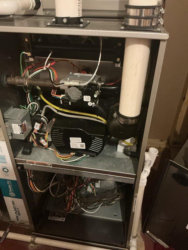 # Tankless Water Heater Flush and HVAC System Maintenance

Performed comprehensive maintenance service on tankless water heater system including drain cleaning and complete system flush to remove mineral deposits and sediment buildup. Accessed internal components by removing front access panel to inspect heat exchanger, gas valve assembly, and burner components. Verified proper operation of all mechanical and electrical connections throughout the unit.

Conducted thorough inspection of integrated HVAC system components including blower motor assembly, gas valve connections, and electrical wiring harnesses. Examined PVC condensate drainage and venting systems for proper flow and secure connections. All colored wiring connections, wire nuts, and electrical terminals were inspected and confirmed secure with no signs of deterioration or damage.

Verified system operation following flush procedure with all components functioning within normal parameters. Documented unit condition through ph