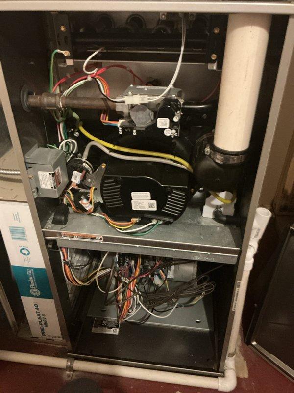 # Tankless Water Heater Flush and HVAC System Maintenance

Performed comprehensive maintenance service on tankless water heater system including drain cleaning and complete system flush to remove mineral deposits and sediment buildup. Accessed internal components by removing front access panel to inspect heat exchanger, gas valve assembly, and burner components. Verified proper operation of all mechanical and electrical connections throughout the unit.

Conducted thorough inspection of integrated HVAC system components including blower motor assembly, gas valve connections, and electrical wiring harnesses. Examined PVC condensate drainage and venting systems for proper flow and secure connections. All colored wiring connections, wire nuts, and electrical terminals were inspected and confirmed secure with no signs of deterioration or damage.

Verified system operation following flush procedure with all components functioning within normal parameters. Documented unit condition through ph
