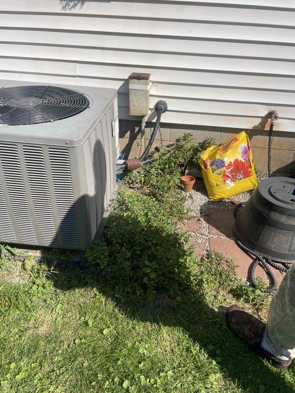 Completed full system replacement estimate for residential HVAC equipment including 30+ year old gas furnace located in basement and matching-age central air conditioning condenser unit positioned on exterior concrete pad. Documented existing system configuration, ductwork connections, and equipment specifications through photographic assessment. Provided comprehensive replacement options for complete heating and cooling system upgrade to improve efficiency and reliability.