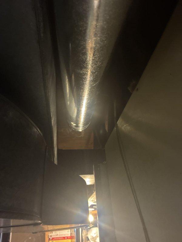 Performed routine maintenance service on air conditioning system including filter replacement and evaporator pad servicing. Inspected electrical panel and HVAC ductwork, documenting significant condensation present on supply ductwork which may indicate insulation deficiency or excessive humidity levels requiring future attention.