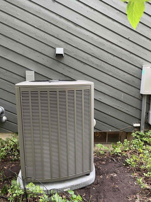 Completed full HVAC system installation including 90,000 BTU furnace in basement utility area and 3-ton air conditioning condenser unit positioned on concrete pad in left side yard. Installed evaporator coil, humidifier, and all necessary ductwork connections with proper metallic ducting secured to ceiling joists. Reconnected all electrical components including disconnect panel, completed all mechanical connections, and verified system operation upon startup.