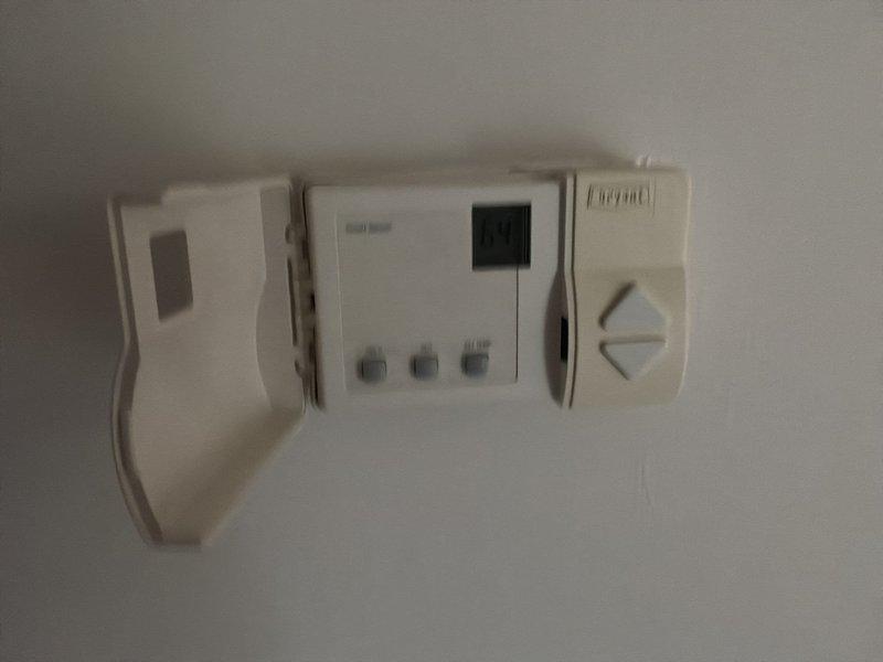 Provided estimate for complete zone system replacement including thermostats after diagnosing nonfunctional zone control system causing restricted airflow and subsequent evaporator coil freezing. Documented existing wall-mounted thermostat units and zone control panel with exposed wiring connections for replacement specifications.
