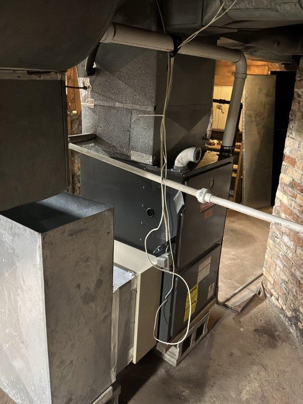Conducted estimate for furnace replacement on 20-year-old existing unit located in basement utility room. Assessed current system condition, noting aged equipment with moisture accumulation on ductwork and metal components. Evaluated installation space, existing ductwork configuration, wooden framing structure, and accessibility for replacement work. Documented equipment specifications, venting requirements, and electrical connections. Provided homeowner with comprehensive replacement options and recommendations based on current system layout and mechanical room conditions.