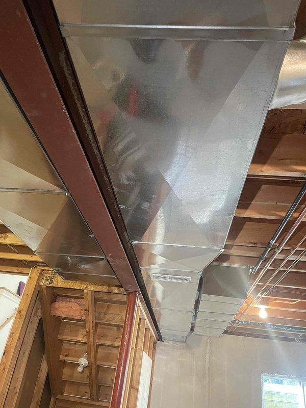 Provided comprehensive estimate for multi-zone HVAC system installation in residential property undergoing basement remodeling. Assessed requirements for three separate zones including new basement zone, first story zone, and third story zone to accommodate home expansion and improved climate control. Evaluated existing ductwork configuration in basement and attic spaces, documented current system layout with natural gas furnace located in basement, and determined zoning requirements for enhanced comfort and efficiency throughout the multi-level residence.