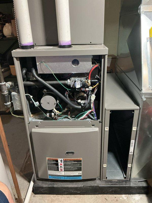 Completed comprehensive 5-year recurring ComfortGuard maintenance service on residential HVAC system. Performed thorough inspection of indoor furnace unit, accessing internal components including draft inducer motor, control board, electrical connections, and heat exchanger. Evaluated all wiring harnesses, safety controls, and ventilation piping for proper operation and code compliance.

Inspected outdoor condensing unit and noted vegetation encroachment requiring clearance maintenance for optimal airflow and system efficiency. Verified proper condenser operation, refrigerant lines, and electrical connections at exterior unit.