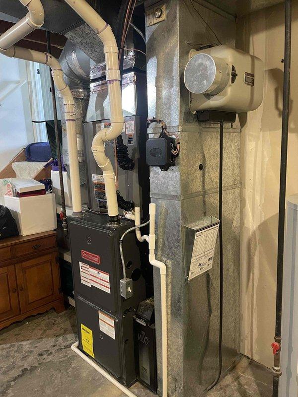 Completed installation of 2.5 ton air conditioning system with matching evaporator coil. Positioned outdoor condensing unit on mounting pad with rock bed in right side yard, installed electrical disconnect and conduit connection to exterior wall. Inside mechanical room, installed new evaporator coil and connected refrigerant lines to existing furnace system, integrated ductwork connections, and completed all electrical wiring. System was charged with refrigerant, tested for proper operation, and all connections verified for secure fit and proper airflow.