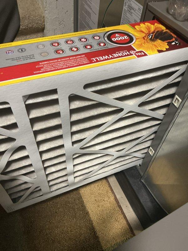 Completed comprehensive ComfortGuard Maintenance Package including replacement of HVAC air filters with new Honeywell pleated filters at the indoor air handling unit. Inspected outdoor condensing unit and documented moderate accumulation of dirt, debris, and organic matter on condenser coils and base, with visible buildup between fins requiring attention during future maintenance intervals.