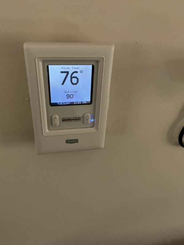 Completed annual furnace tune-up and inspection on 14-year-old heating system located in basement. Performed comprehensive maintenance including filter inspection, thermostat functionality check, and full system evaluation. Unit operating properly with no issues found; Bryant thermostat displaying accurate room temperature of 76° and responding correctly to controls.