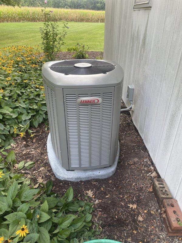 Completed full installation of 3-ton Lennox air conditioning system with matching evaporator coil. Positioned condenser unit on concrete pad adjacent to building exterior, connected refrigerant line set through building penetration, and established proper drainage with PVC condensate lines mounted to exterior siding. System tested and verified operational with all electrical connections secured and permit documentation submitted for mechanical inspection.
