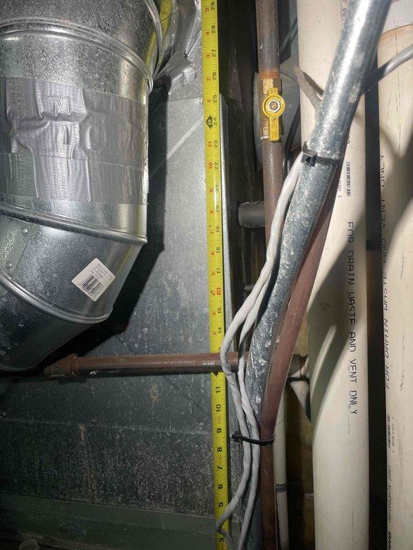 Provided estimate for complete furnace and air conditioning system replacement in basement location. Existing 15-20 year old furnace is non-operational and requires replacement. Measured clearances and documented existing HVAC equipment, ductwork, copper refrigerant lines, and venting configuration to determine proper sizing and installation requirements for new system.
