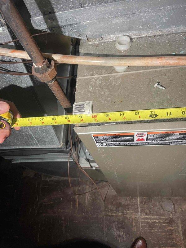 Provided estimate for complete furnace and air conditioning system replacement in basement location. Existing 15-20 year old furnace is non-operational and requires replacement. Measured clearances and documented existing HVAC equipment, ductwork, copper refrigerant lines, and venting configuration to determine proper sizing and installation requirements for new system.