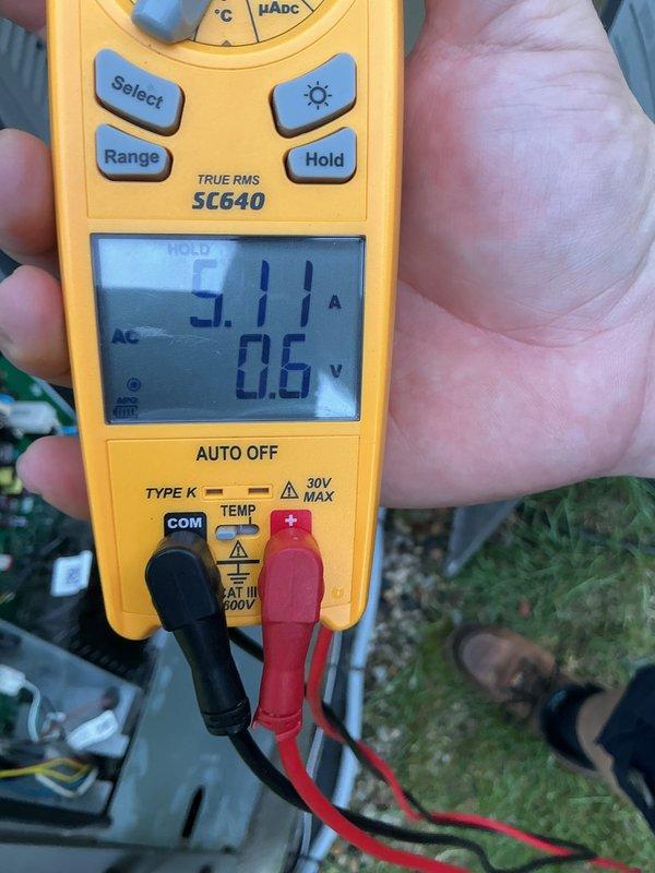 Performed comprehensive AC tune-up and preventive maintenance on residential cooling system as part of Hager Fox Air Care membership. Inspected outdoor condenser unit including top access panel and filter, which showed normal accumulation of dirt and debris. Measured system amperage at 3.17A using digital multimeter to verify proper compressor operation and electrical performance within manufacturer specifications.