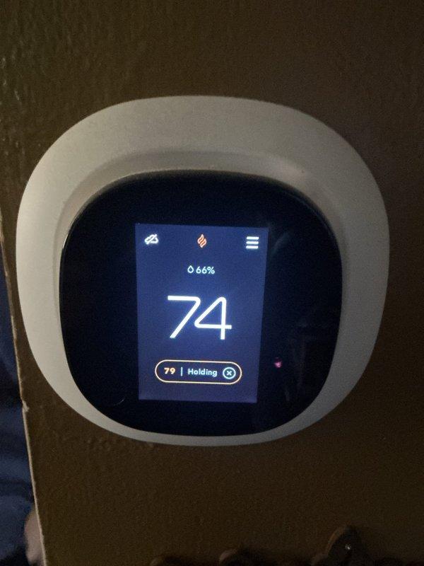 Completed annual heating maintenance on residential forced-air furnace system. Performed comprehensive inspection of all major components including gas valve assembly, blower motor, electrical connections, and control wiring. Verified thermostat operation and confirmed system holding temperature at 70°F with proper humidity reading of 66%. Inspected interior furnace cabinet, checked all wire connections across multiple circuits, and examined condensate drain line routing. All components found operating within normal parameters with no immediate service needs identified.