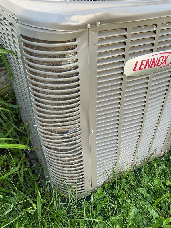 Completed comprehensive annual cooling maintenance on Lennox air conditioning system under Air Care membership agreement. Performed full AC tune-up including inspection of outdoor condenser unit, verification of fan operation and blade condition, examination of exterior housing and ventilation louvers, and assessment of overall system condition. Unit found in operational condition with minor debris accumulation noted in ventilation slats; cleaned as needed to ensure proper airflow. All components functioning within normal parameters with no immediate service concerns identified.