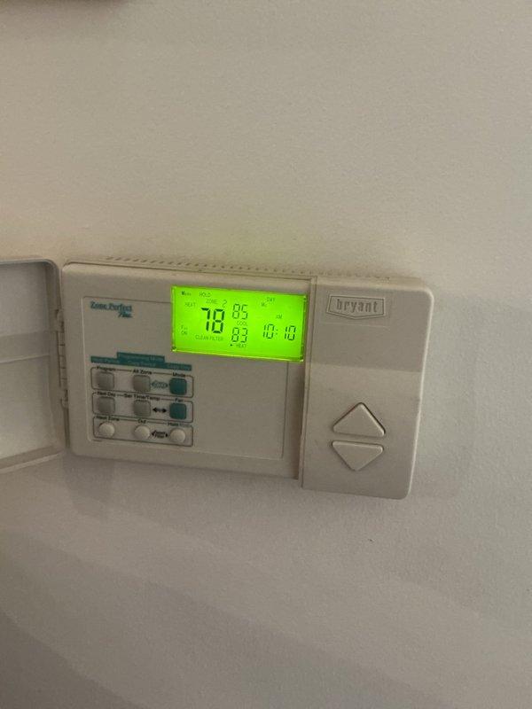 Completed ComfortGuard Maintenance package including filter and evaporative cooler pad replacement. Verified thermostat operation showing proper display function at 78°F setpoint. Removed and replaced dirty expanded metal mesh filter from evaporative cooler media tray, which showed moderate dust accumulation and discoloration from use.