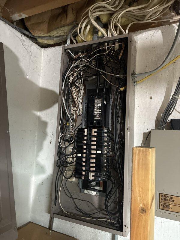 Provided comprehensive estimate for replacement of 22-year-old furnace and air conditioning system located in basement, with current A/C unit experiencing short cycling issues. Assessed existing equipment layout, electrical service panel capacity, and available space for new installation including proper clearances for ductwork and refrigerant lines. Documented site conditions and utility connections to prepare detailed proposal for complete HVAC system replacement with natural gas furnace and new condensing unit.