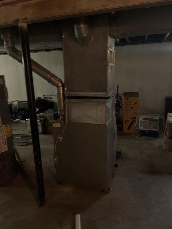 Completed full system estimate for residential property requiring replacement of 22-year-old furnace from 2004 and installation of new air conditioning unit under promotional package. Assessed existing basement HVAC infrastructure including ductwork configuration, electrical service capacity, and available space for new equipment installation. Documented current furnace condition and absence of air conditioning system, photographed existing equipment and installation area, and provided comprehensive proposal for complete heating and cooling system replacement.