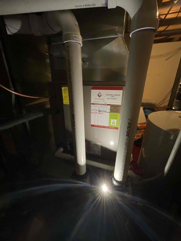 Completed follow-up site visit to assess non-operational natural gas forced air furnace and air conditioning system located in basement. Documented existing Payne brand equipment configuration including furnace with Z-vent PVC exhaust system and outdoor condensing unit for replacement estimate. Generated quote for complete HVAC system replacement.