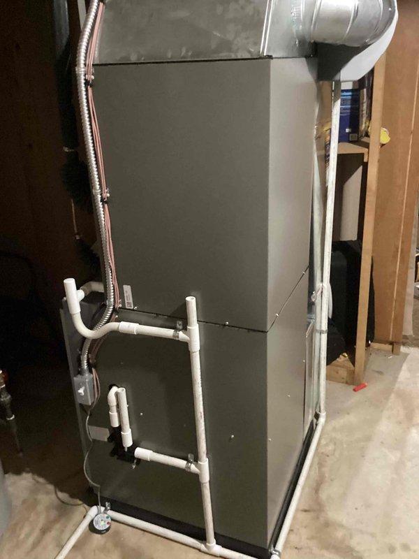 Completed full HVAC system installation including a 90,000 BTU gas furnace with humidifier and 3-ton air conditioning system with evaporator coil. Installed new air handler unit in basement with proper condensate drainage lines and ductwork connections, and positioned outdoor condenser unit on concrete pad with electrical reconnection. All equipment installed per manufacturer specifications and permit requirements, with system tested and operational upon completion.