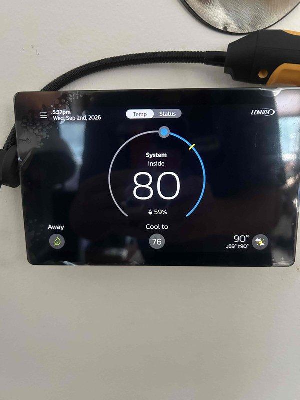 Responded to service call for Lennox thermostat overcooling past set temperature. Upon arrival, diagnosed system control issue causing cooling system to run beyond programmed setpoint of 74-76 degrees. Performed diagnostic testing of thermostat functions, verified display readings showing indoor temperature at 80 degrees with cooling target set to 74 degrees and outdoor temperature at 90-91 degrees. Identified malfunction in temperature differential control preventing proper system cycling. Completed necessary repairs and adjustments to restore proper thermostat operation and temperature regulation.