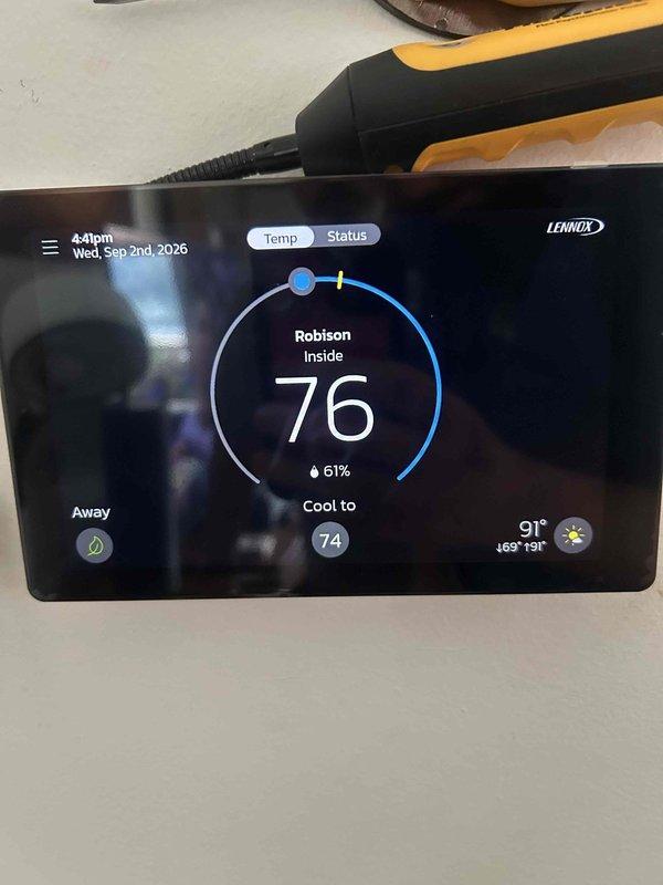 Responded to service call for Lennox thermostat overcooling past set temperature. Upon arrival, diagnosed system control issue causing cooling system to run beyond programmed setpoint of 74-76 degrees. Performed diagnostic testing of thermostat functions, verified display readings showing indoor temperature at 80 degrees with cooling target set to 74 degrees and outdoor temperature at 90-91 degrees. Identified malfunction in temperature differential control preventing proper system cycling. Completed necessary repairs and adjustments to restore proper thermostat operation and temperature regulation.