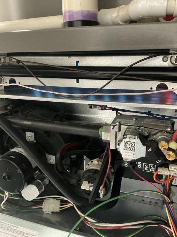 Completed comprehensive 5-year recurring ComfortGuard maintenance service on Lennox HVAC system. Performed full system inspection including thermostat functionality verification, internal component examination, electrical connection assessment, and control board evaluation. Thermostat displayed proper operation with accurate temperature readings and system mode controls functioning correctly. Inspected internal unit components including blower motor assembly, wiring harnesses, circuit board terminals, and mechanical mounting hardware, confirming all connections secure and components operating within normal parameters.