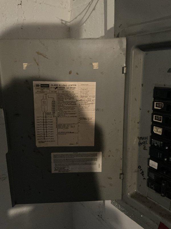 Responded to service call for non-functional second floor outlets suspected to be related to tenant air conditioning unit usage. Inspected main electrical panel and circuit breakers, documented panel configuration and circuit directory. Assessed basement electrical infrastructure and identified potential overload conditions that may have caused circuit interruption.