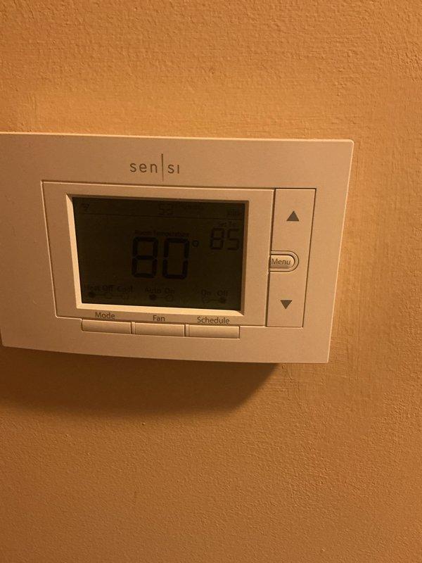 Completed routine AC tune-up and furnace maintenance on residential HVAC system with 15-year-old forced air furnace originally installed by Hager Fox. Replaced air filter in air handler unit, verified thermostat operation showing 80°F on Sensi digital unit, and confirmed both heating and cooling systems functioning properly with no issues identified during inspection.