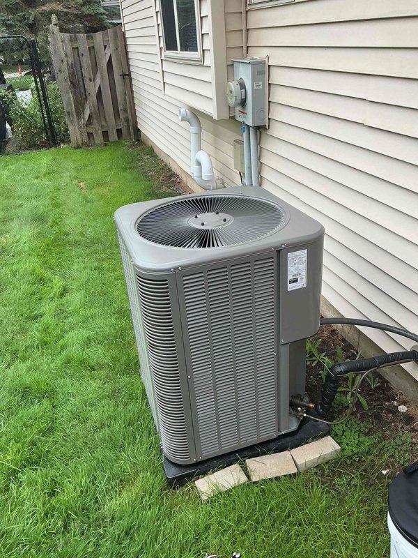 Responded to no cooling complaint on 1-year-old residential AC system with history of recent refrigerant leak repair. Upon arrival, performed comprehensive system evaluation including indoor air handler in basement and outdoor condensing unit. Conducted refrigerant pressure testing and leak detection procedures to identify source of recurring issue. Found evidence of refrigerant loss consistent with previous service history. Performed electronic leak detection on all refrigerant circuit components including evaporator coil, condensing unit, line set connections, and service ports. Located active leak at refrigerant connection point. Recovered remaining refrigerant from system per EPA regulations. Repaired leak, evacuated system to proper vacuum levels, and recharged unit to manufacturer specifications. Verified proper system operation with temperature split readings and confirmed adequate cooling performance. System restored to normal operation with cold air delivery confirmed at suppl
